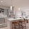 a kitchen with a dining table and chairs